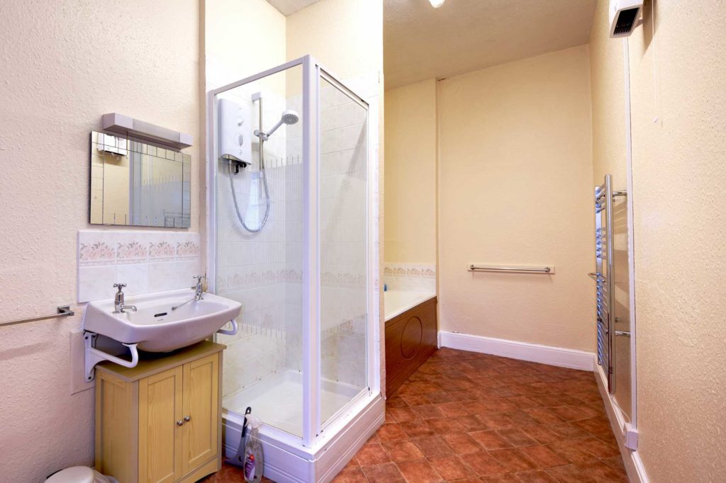 Bathroom with shower cubicle, bath, and sink